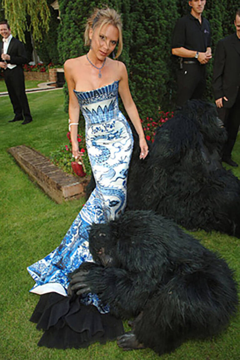 Victoria Beckham with gorillas at Elton John's African themed White Tie & Tiara Ball